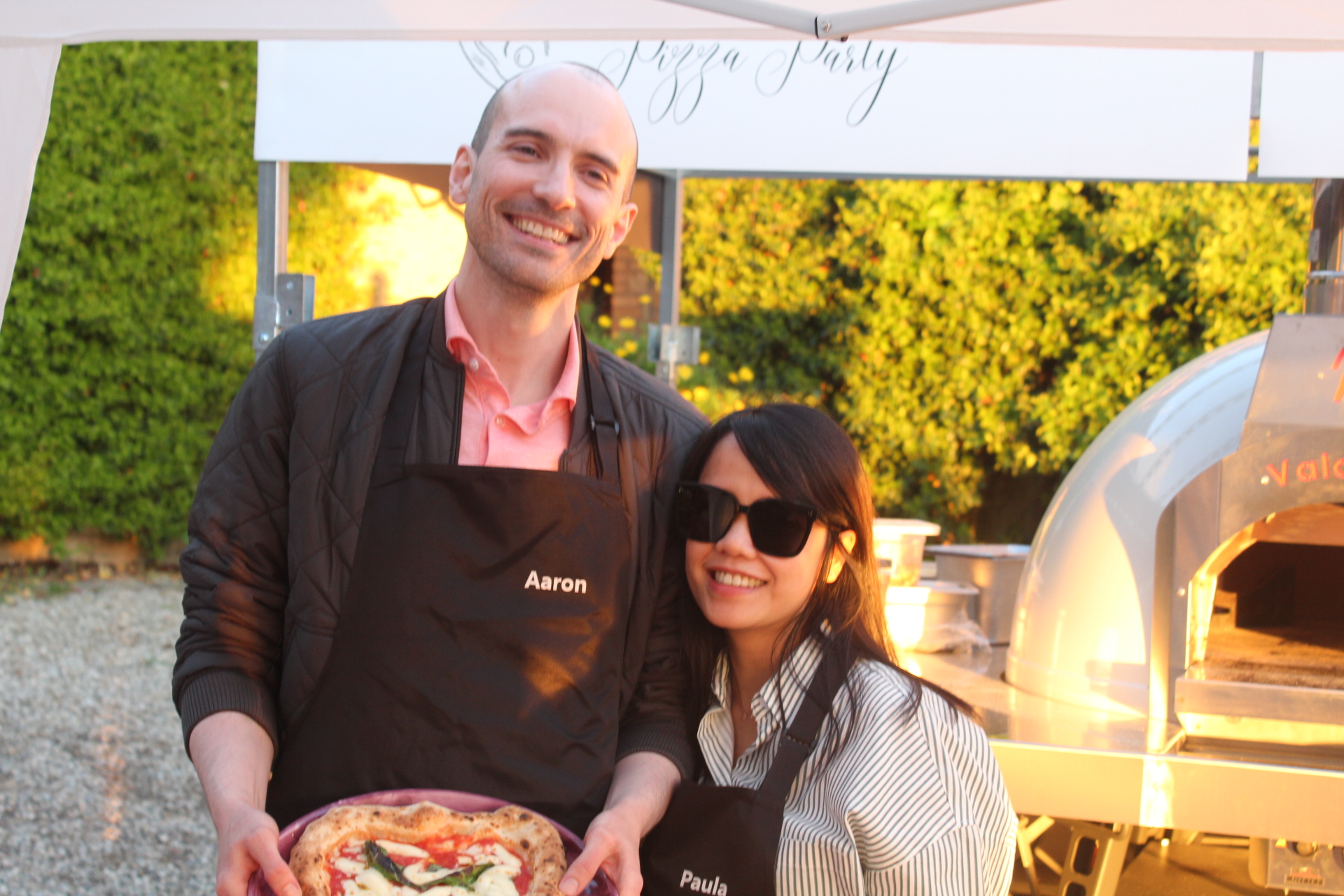 Wedding guests being served Neapolitan pizza at a villa in Tuscany