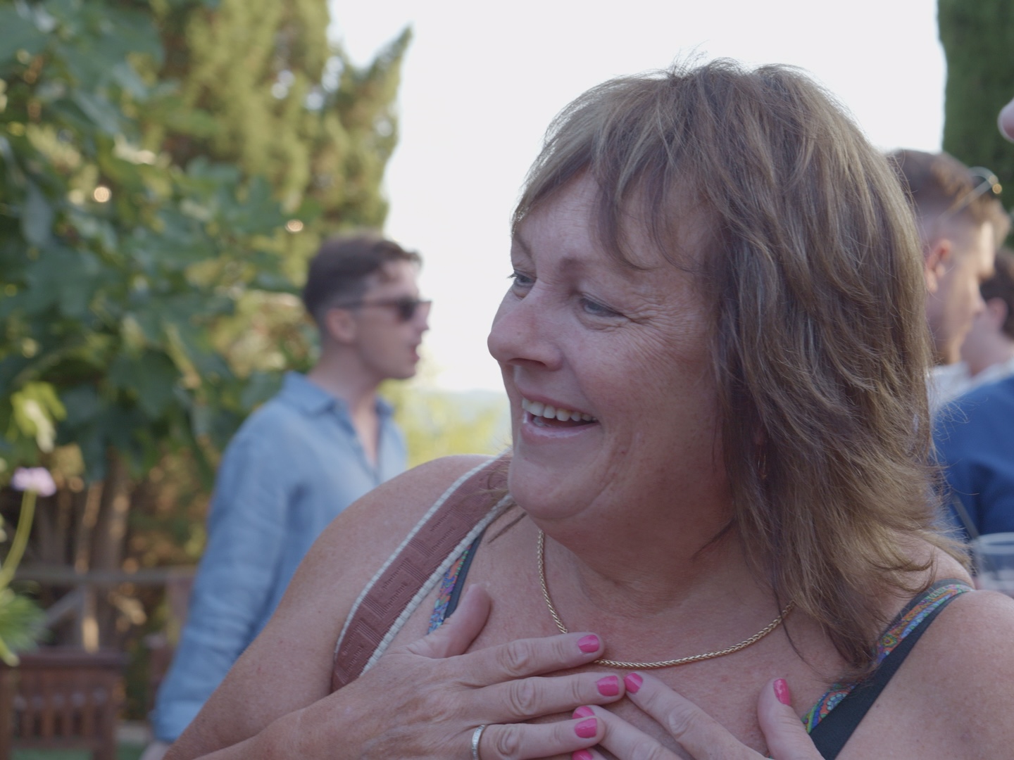 A guest laughing during the party in the villa garden