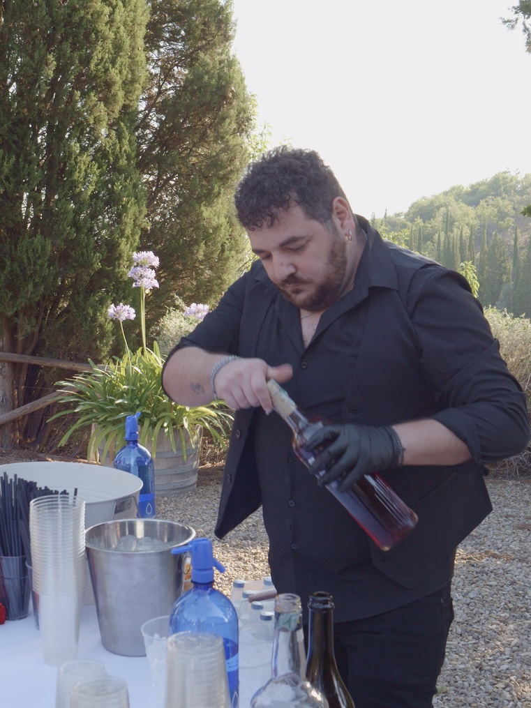 Our team opening bottles at the drinks table during service