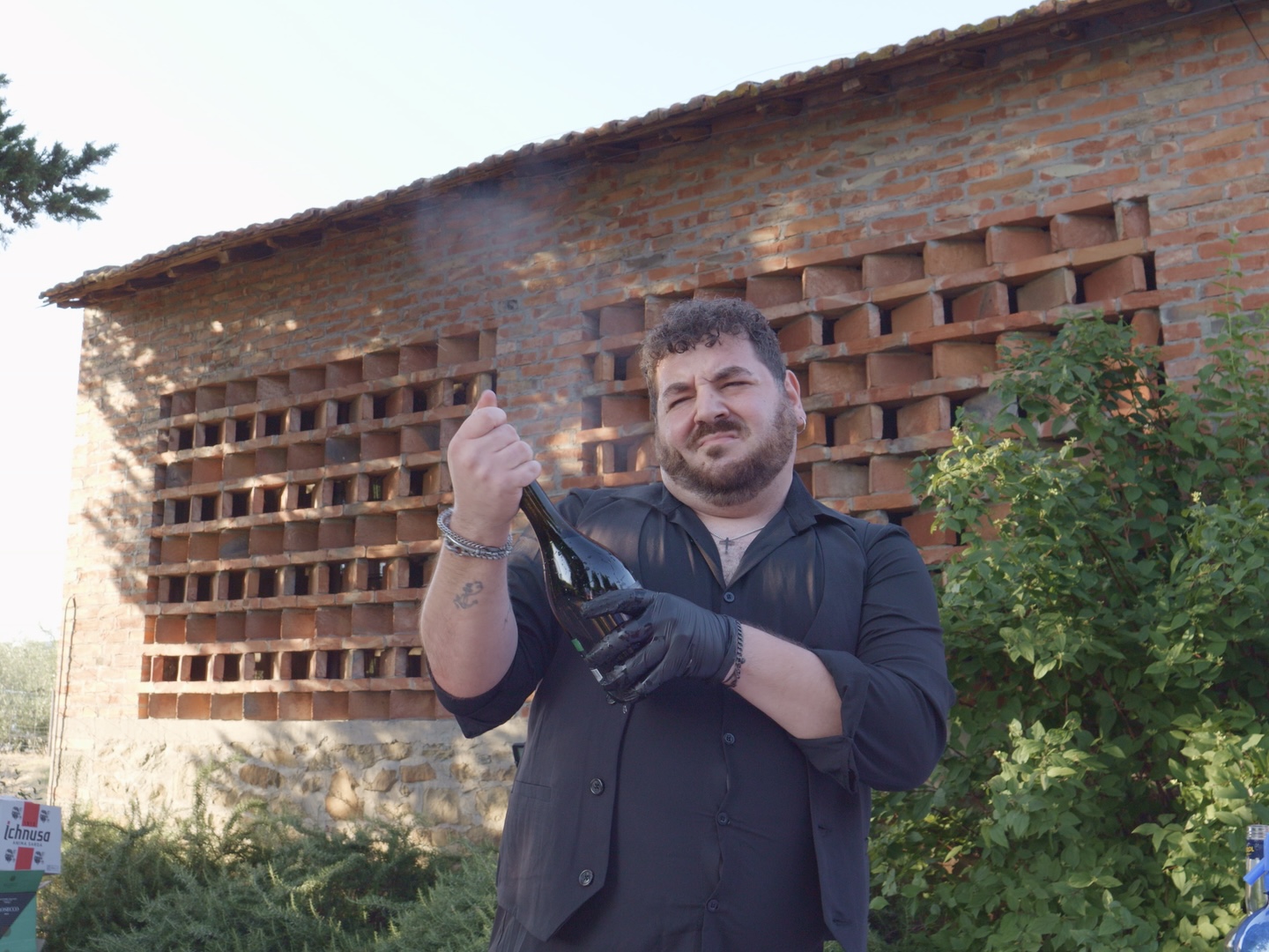 Opening a bottle of prosecco at a Tuscan celebration