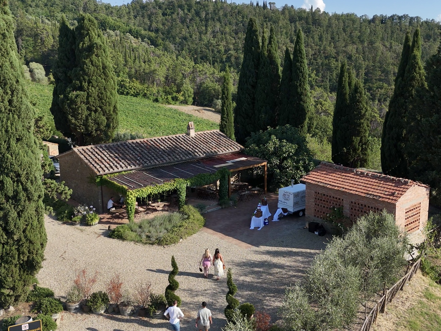 Our pizza truck parked beside a stone farmhouse in the Tuscan hills