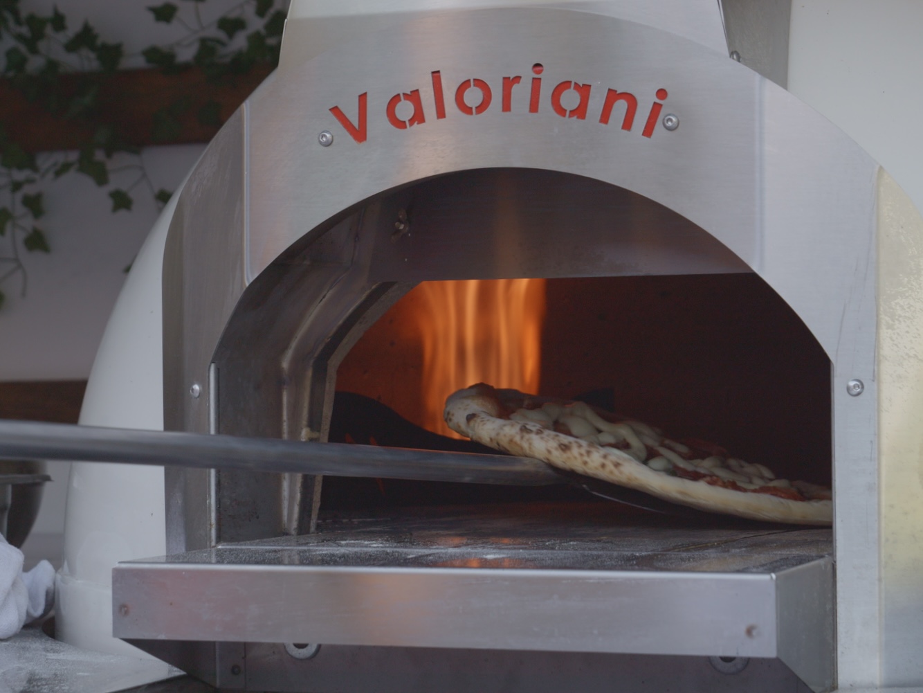 A Neapolitan pizza going into our Valoriani gas oven