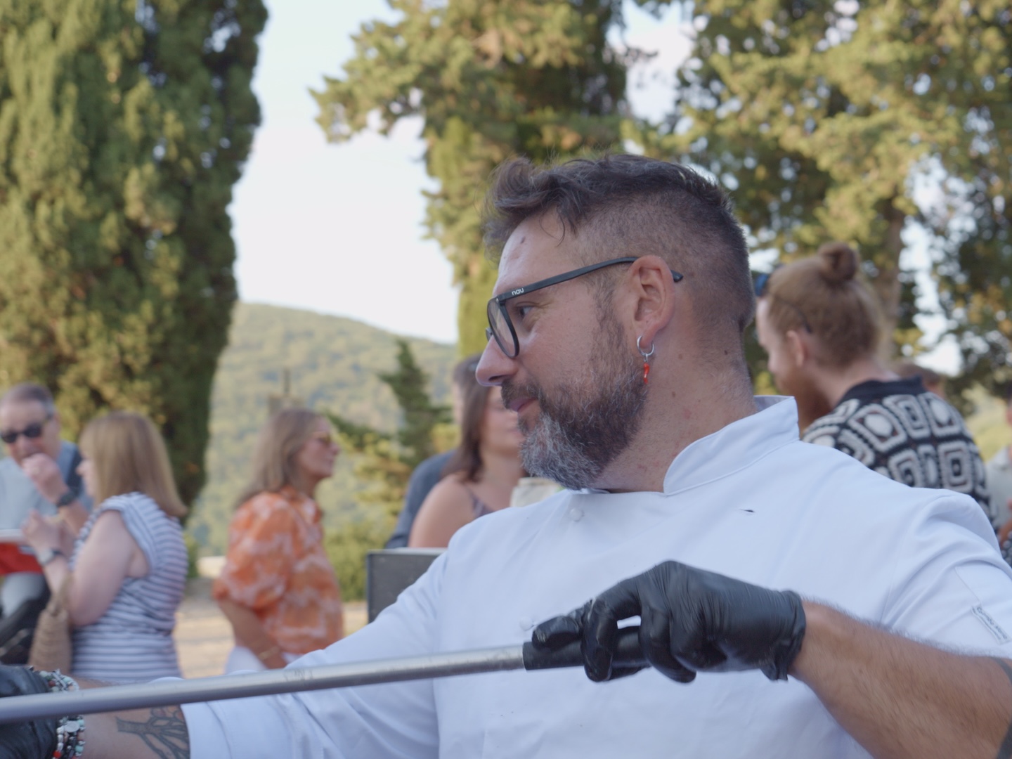 Our mobile pizza truck parked and serving during an evening wedding event in the Tuscan countryside